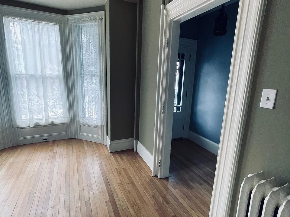 View of living room and front entrance from dining room doorway