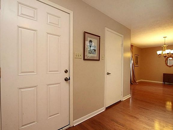 As you enter there is a Dining room on the left .