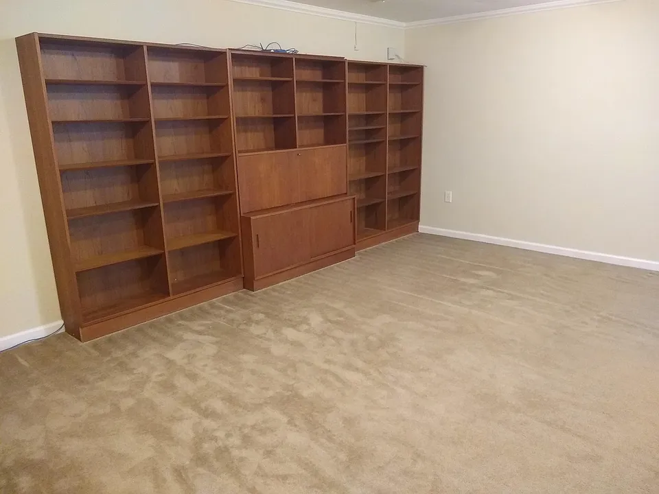Living Room with teak desk and bookcase for your use.