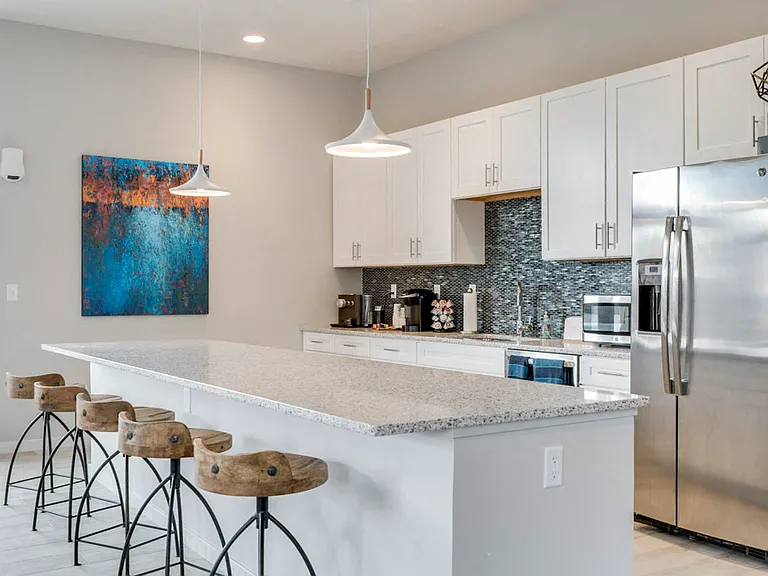 Our lubhouse kitchen offers a sleek and functional space for hosting gatherings.
