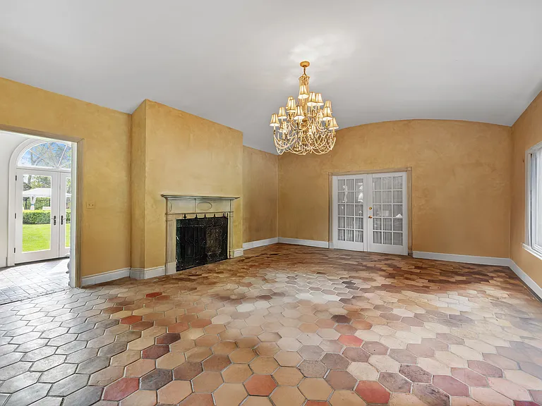 Living Room w/entrance to Home Office and opening to Sunroom