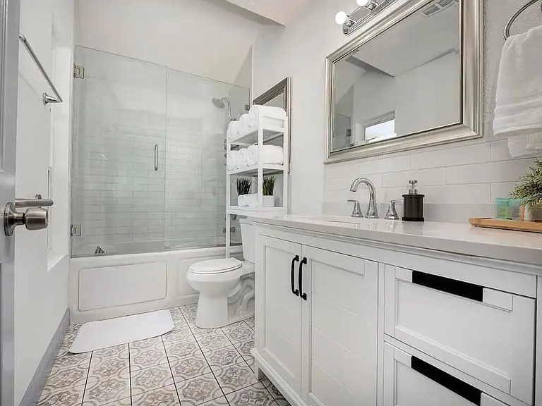 jetted bathtub in the hallway bathroom