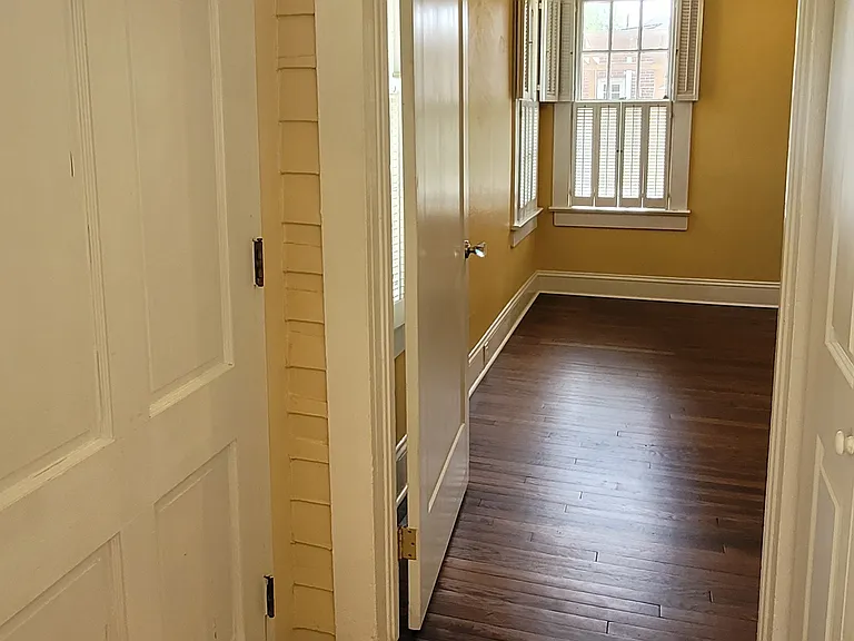 Backdoor and entry to back bedroom