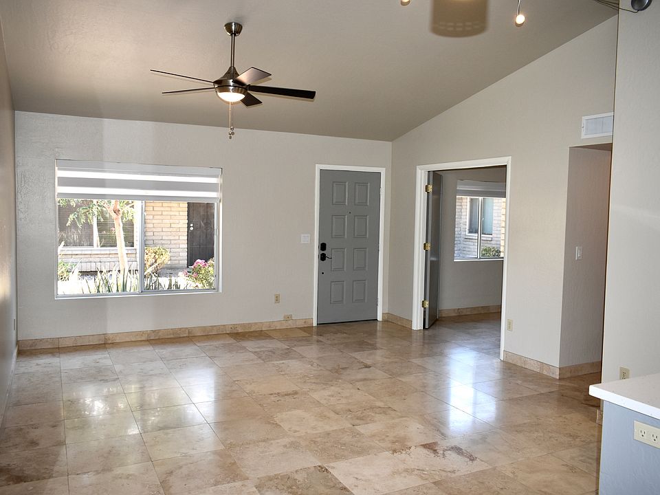 View of Living Room from the Dining Area. Living Room window looks out to shared courtyard.