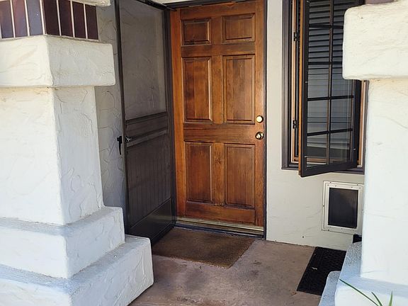 Front door with screen door and side window