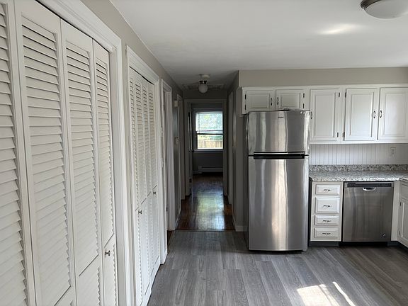 hallway to bedrooms and bathroom, much storage along the wall