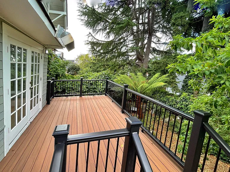 back deck with strong outdoor gas heater, for outdoor meals year round.
