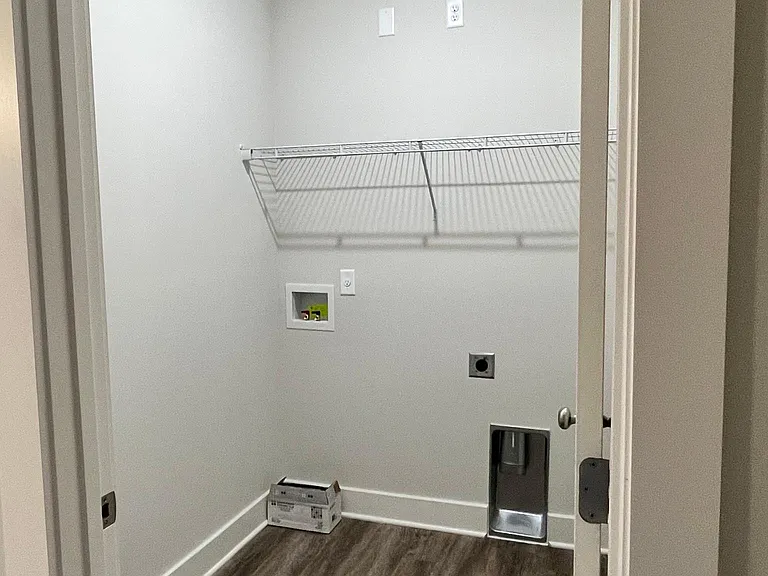 Spacious laundry near primary bedroom.
