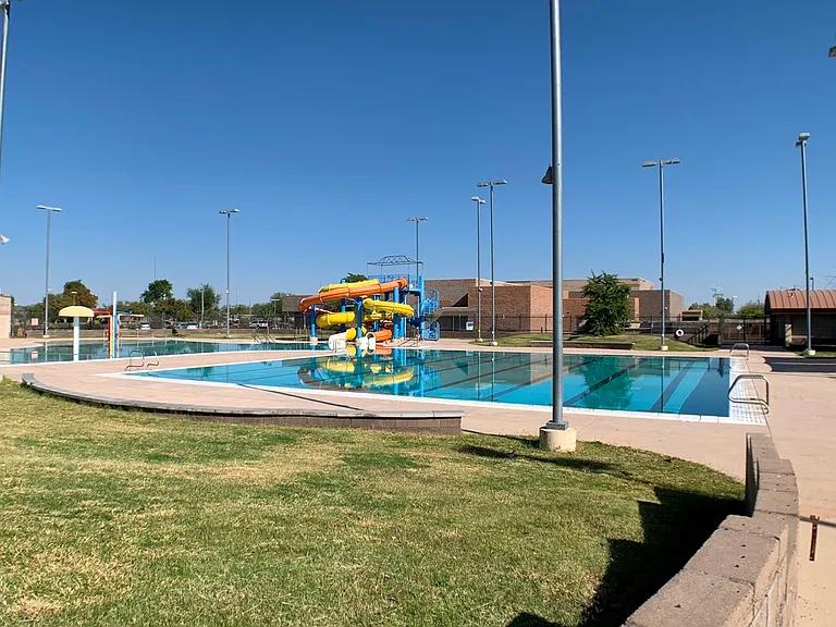 Large pools include water slide, splash pad, lane swim & play pool