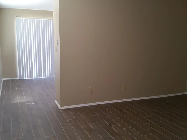 Entrance, kitchen behind wall