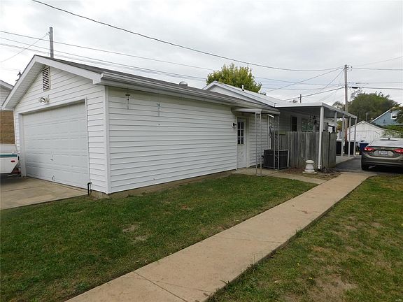 Detached garage (used for storage) with additional rental unit with covered porch