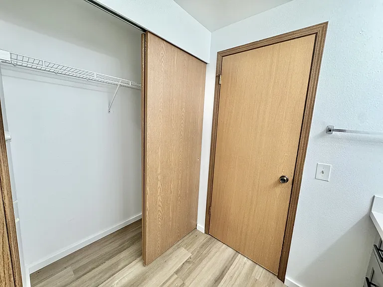 Bathroom contains full-size double door closet for additional storage.