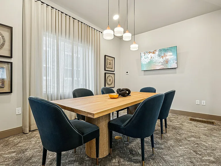 Experience the elegance of a stylish dining room designed for comfort and sophistication.