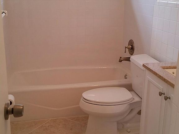 Brand new bath with cast iron tub. elongated commode, new va
