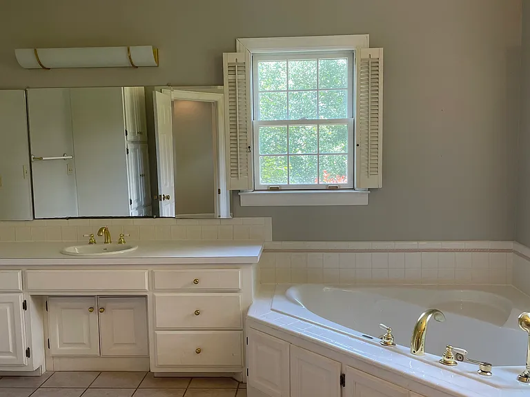 Master bath with jacuzzi tub and walk in shower