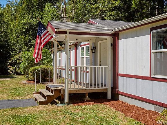 Covered front porch. Updated landscaping. New paint on trim. 