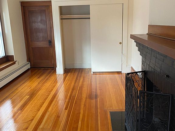 Another view of living room and stairs to front entranceway.