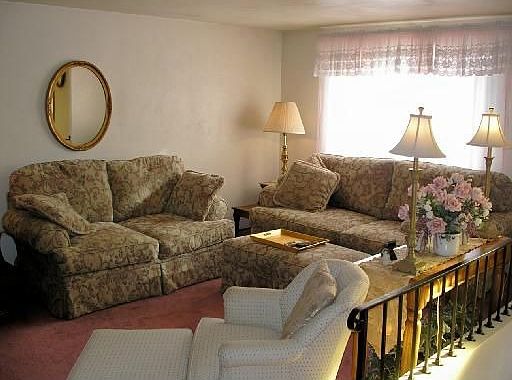 Living Room is 18x14, with hardwood floors under carpet.