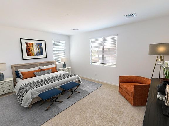 Virtually staged primary bedroom at Heritage plan in Highland Ridge