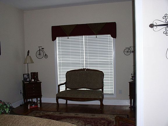 Formal living room features custom built cornice board window treatment!