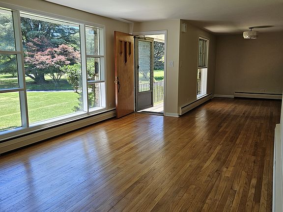 Livingroom with picture window, front door to front porch, diningroom off kitchen