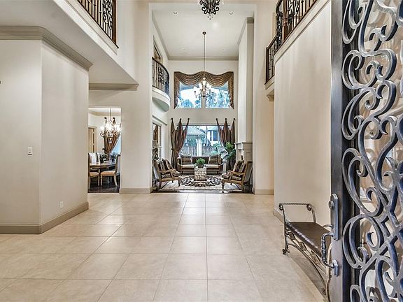 An exquisite Home located in Estate Gated Section of the Falls at Campion Forest; The elegant entry is enhanced with a Foyer with High ceilings, and Tile flooring