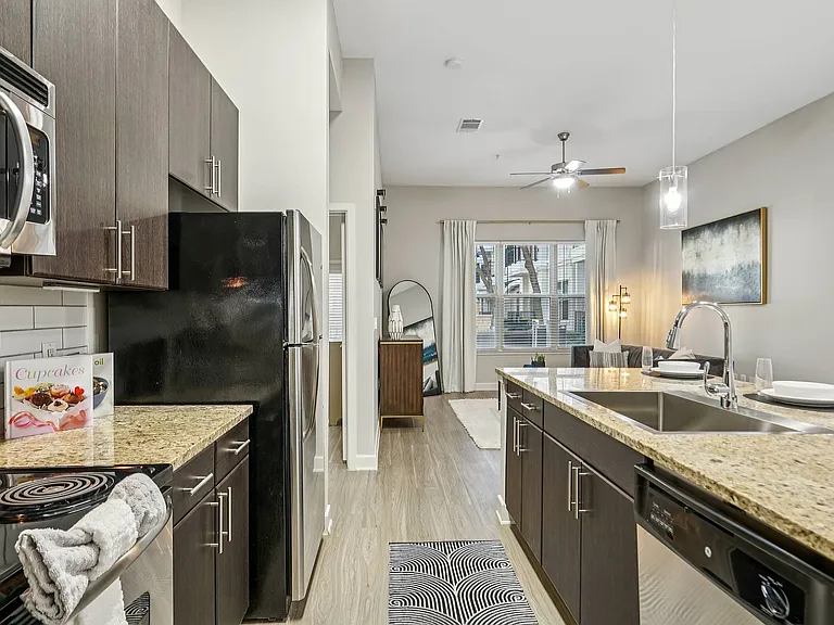Enjoy cooking in your stylish, modern kitchen at Addison Keller Springs in Addison, TX