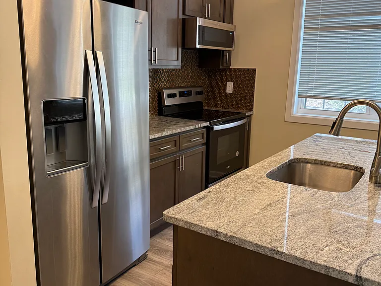 Kitchen area with new appliances