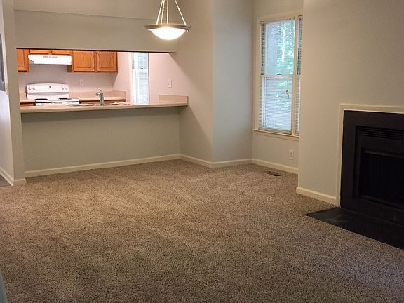 Living Room/Dining Room Combo with Wood Burning Fireplace