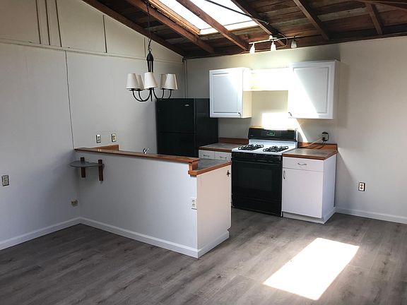 Kitchen with gas burners. Just re-floored.