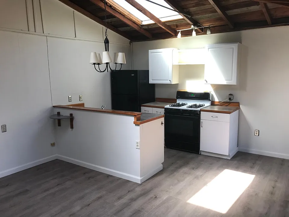 Kitchen with gas burners. Just re-floored.