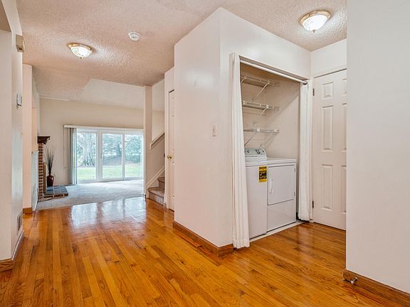 Hallway with laundry area.