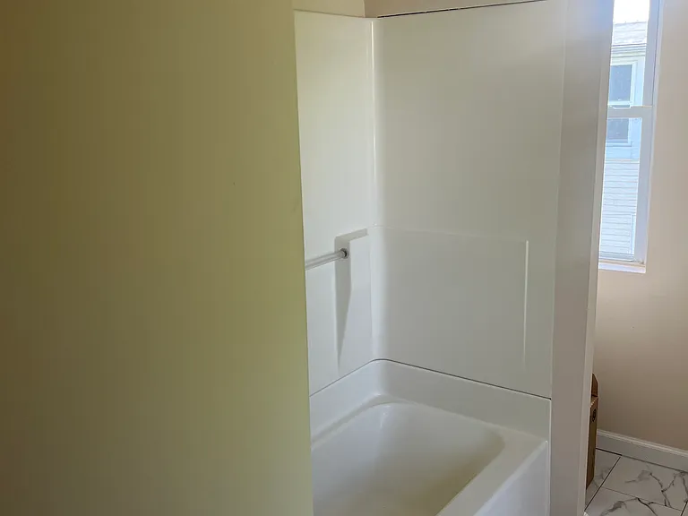 Bathroom is vinyl plank flooring