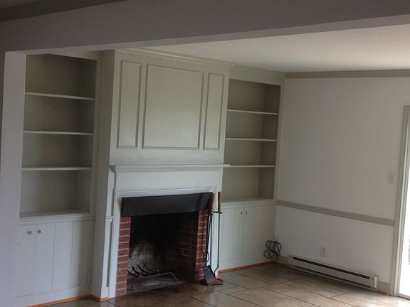 wood burning fireplace, built-in book cases