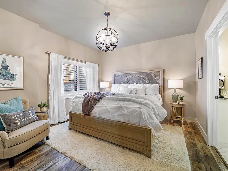 Master Bedroom Suite With Adjoining Master Bathroom And Large Walk In Closet With Custom Shelving