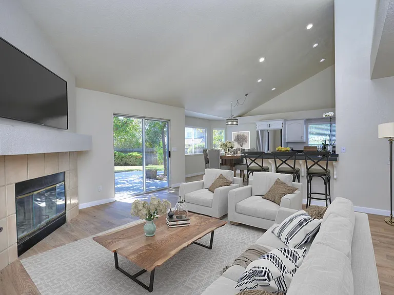 GreatRoom with fireplace, vaulted ceilings off kitchen