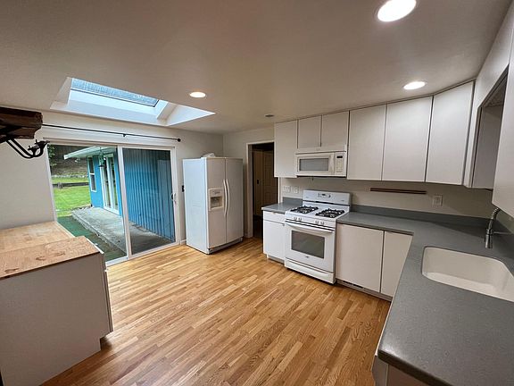 Kitchen with entrance to backyard
