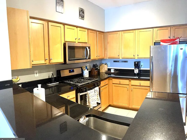 Kitchen has all steel appliances. Microwave, dishwasher, refrigerator etc.