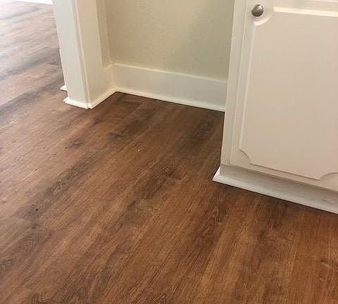 wood floors in the kitchen and every room