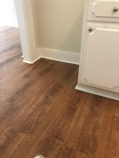 wood floors in the kitchen and every room
