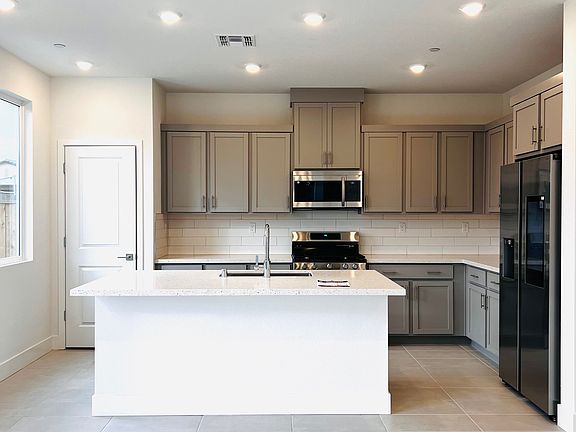 Kitchen with Breakfast counter and pantry.