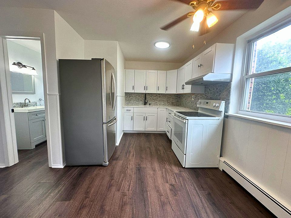 Bright and airy renovated kitchen with window view.