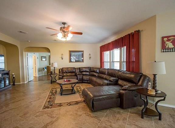 The living room is very large and opens to the foyer as well as the dining and kitchen not shown in this picture.