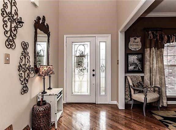 Warm & inviting 2 story entry welcomes you home