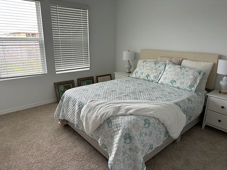 Master bed before pictures were put on wall