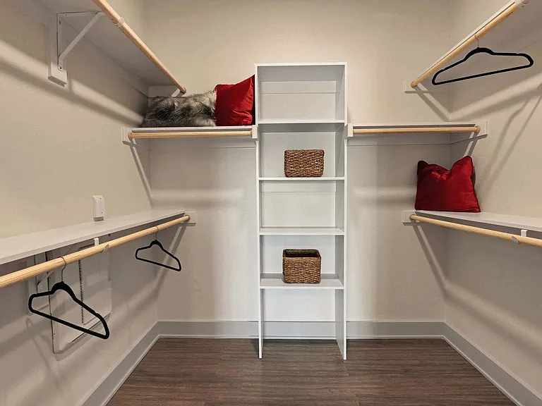 Large walk-in closets with shelving in select bedrooms.