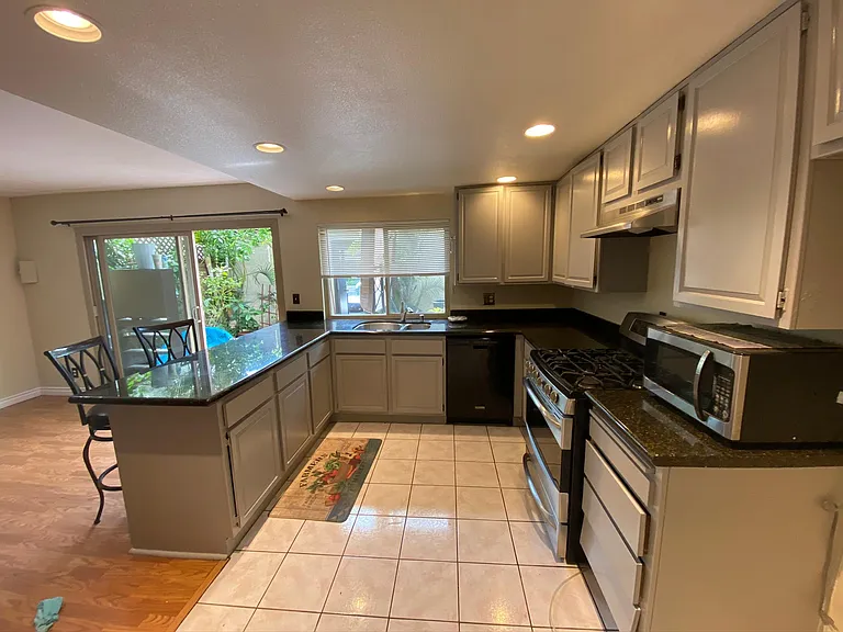 Kitchen - Cooking gas range, dishwasher