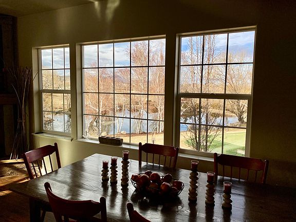 View of pond, grounds and putting green