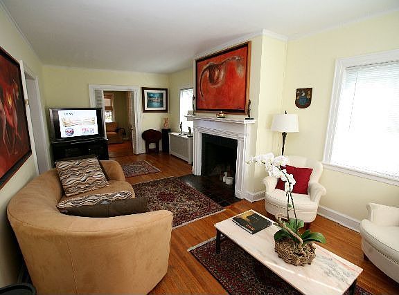 living room w/wood burning fireplace