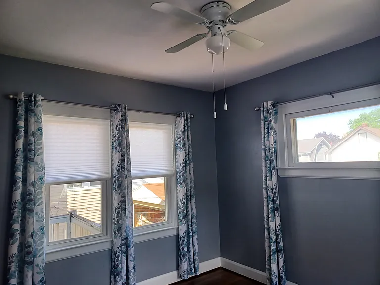 Bonus room 3 with newer windows and optional window treatments for tenant use. This room does not have a closet.